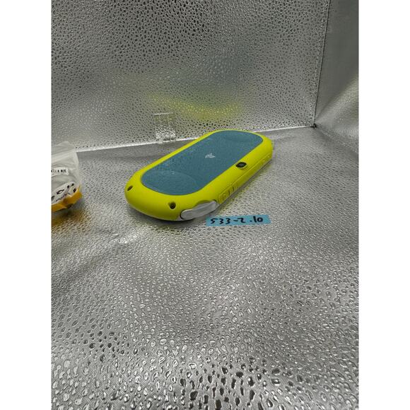 white/yellow with a dash of light blue ps vita 2000 w/charger - Picture 8 of 8